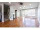 Open living room boasting hardwood floors and fireplace at 11338 Musette Cir, Alpharetta, GA 30009