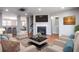 Cozy living room featuring a fireplace, plush seating, and stylish decor at 11338 Musette Cir, Alpharetta, GA 30009