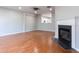 Bright living room featuring hardwood floors and a fireplace at 11338 Musette Cir, Alpharetta, GA 30009