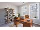 Home office with a large desk and bookcase at 11338 Musette Cir, Alpharetta, GA 30009