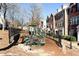 Community playground features a climbing structure with multiple swings and slides at 11338 Musette Cir, Alpharetta, GA 30009