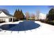 Community pool features a large deck with a protective winter cover at 11338 Musette Cir, Alpharetta, GA 30009