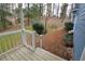 Back porch with a brick patio and serene wooded backdrop at 3701 W Lawrenceville St, Duluth, GA 30096