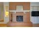 Traditional brick fireplace with white mantel and built-in cabinets on either side at 3701 W Lawrenceville St, Duluth, GA 30096