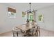 Dining room with modern light fixture, neutral colors and bright windows at 709 Mirror Lake Pkwy, Villa Rica, GA 30180