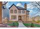 Charming two-story home with stone accents, detailed black shutters and a beautifully landscaped front yard at 1527 Markan Ne Dr, Atlanta, GA 30306