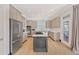 Modern open concept kitchen with stainless steel appliances and marble counters at 1527 Markan Ne Dr, Atlanta, GA 30306