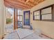 Covered patio with stone flooring and a door leading to a private outdoor space at 1527 Markan Ne Dr, Atlanta, GA 30306