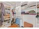 Organized walk-in closet with shelves, hanging racks, and hardwood floors is a dream for storage solutions at 1527 Markan Ne Dr, Atlanta, GA 30306