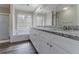 Bathroom vanity with double sinks, granite countertop, tub, and shower at 3174 Palm Tree Dr, Lithonia, GA 30038