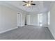 Bedroom with a ceiling fan and three doorways at 3174 Palm Tree Dr, Lithonia, GA 30038