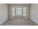 Cozy bedroom featuring a large bay window and neutral carpeting at 3174 Palm Tree Dr, Lithonia, GA 30038