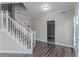 Hallway features wood floors, white trim, and stairs at 3174 Palm Tree Dr, Lithonia, GA 30038