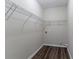 Walk-in closet featuring laminate floor and wire shelving at 3174 Palm Tree Dr, Lithonia, GA 30038