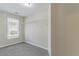 Walk-in closet featuring shelving and a window for natural light at 3174 Palm Tree Dr, Lithonia, GA 30038