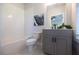 Bright bathroom featuring a combination tub and shower with white subway tile and a gray vanity with a white countertop at 608 Goldsmith Ct # 113, Johns Creek, GA 30022