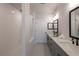 Bathroom featuring double vanity, neutral colors, and a separate shower at 608 Goldsmith Ct # 113, Johns Creek, GA 30022