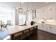 Bright kitchen featuring white cabinetry, stainless steel appliances, and pendant lighting at 608 Goldsmith Ct # 113, Johns Creek, GA 30022