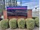 View of the State Bridge Crossing Elementary School sign surrounded by bushes at 608 Goldsmith Ct # 113, Johns Creek, GA 30022