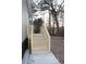 Back porch with wooden stairs offers convenient access to the house at 7382 Knox Bridge Hwy, Canton, GA 30114