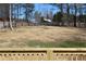 A view of the backyard from a wooden deck with a fenced property line at 7382 Knox Bridge Hwy, Canton, GA 30114