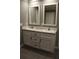 Bathroom vanity featuring granite countertops, dual sinks, and modern cabinetry at 7382 Knox Bridge Hwy, Canton, GA 30114