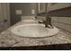 Bathroom vanity featuring granite countertops, dual sinks, and tiled backsplash at 7382 Knox Bridge Hwy, Canton, GA 30114