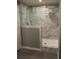 Bathroom features stand-up shower with glass partition and elegant marble tile at 7382 Knox Bridge Hwy, Canton, GA 30114