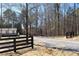 Long gravel driveway leading to the front of a manufactured home with classic architecture at 7382 Knox Bridge Hwy, Canton, GA 30114