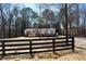 Charming home featuring a covered porch and a neat lawn behind a handsome wooden fence at 7382 Knox Bridge Hwy, Canton, GA 30114