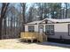 Charming one-story home with a front wooden deck at 7382 Knox Bridge Hwy, Canton, GA 30114