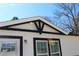 A bright sunlit close up of the gable and window details on a new build home at 7382 Knox Bridge Hwy, Canton, GA 30114