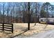 Charming two-tone home with a wooden deck, set back from the gravel driveway at 7382 Knox Bridge Hwy, Canton, GA 30114