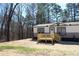 Attractive home with a cozy wooden deck and manicured landscaping at 7382 Knox Bridge Hwy, Canton, GA 30114