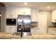 Kitchen island featuring a stainless steel sink, modern faucet, and a wooden countertop at 7382 Knox Bridge Hwy, Canton, GA 30114