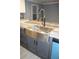 Close up on stainless farmhouse sink and modern faucet at 7382 Knox Bridge Hwy, Canton, GA 30114