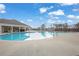 Large, inviting community pool with lounge chairs and umbrellas at 7438 Jennadee Dr, Fairburn, GA 30213