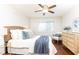 Bedroom features ceiling fan, hardwood floors, a light wood dresser and woven headboard at 100 Biscayne Nw Dr # 4, Atlanta, GA 30309