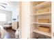 Bedroom featuring a walk-in closet and a light wood dresser with modern woven detailing at 100 Biscayne Nw Dr # 4, Atlanta, GA 30309