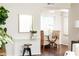 A bright entryway featuring a clear console table and a view of a dining nook at 100 Biscayne Nw Dr # 4, Atlanta, GA 30309