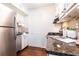 Functional kitchen featuring stainless steel appliances and granite countertops at 100 Biscayne Nw Dr # 4, Atlanta, GA 30309