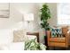 A contemporary living room with decorative pillows and a large houseplant at 100 Biscayne Nw Dr # 4, Atlanta, GA 30309
