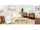 Inviting living room with a white sofa, brown leather chairs, and natural light at 100 Biscayne Nw Dr # 4, Atlanta, GA 30309