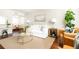 Cozy living room featuring a white sofa, brown leather chairs and a glass coffee table at 100 Biscayne Nw Dr # 4, Atlanta, GA 30309