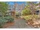 Picturesque courtyard with stone pathway, pergola, and lush green landscaping at 1850 Cotillion Dr # 4204, Dunwoody, GA 30338