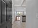 Entryway view into living area featuring tile flooring, and granite counters on kitchen pass-through bar at 1850 Cotillion Dr # 4204, Dunwoody, GA 30338