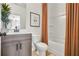 Cozy bathroom featuring a shower-tub combo and a modern vanity for added comfort at 220 Village Overlook # K2, Canton, GA 30114