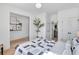 This bright bedroom has an ensuite bathroom, open closet, and stylish decor at 220 Village Overlook # K2, Canton, GA 30114