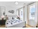 Bright bedroom features a comfortable bed, large windows, and stylish decor at 220 Village Overlook # K2, Canton, GA 30114