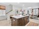 Spacious kitchen island with seating, seamlessly connected to the living room for easy entertaining at 220 Village Overlook # K2, Canton, GA 30114